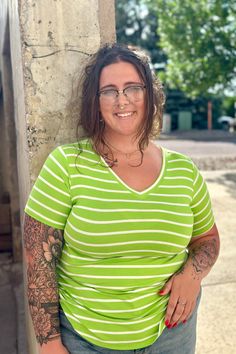 Check out this show-stopping bright lime striped top! Add a serious pop of WOW to your wardrobe with this "Amanda" short-sleeved top. Features a rounded hem, V-neckline and an almost tunic length. Lime Green color with Ivory stripes 95% Rayon / 5% Spandex Measured from a Small: Body Length - 27" / Bust - 35" Measured from a 1X: Body Length - 28.5" / Bust - 43" TTS Fit. Striped Short, Tunic Length, Striped Shorts, Short Sleeve Top, Lime Green, Green Color, Green Colors, Short Sleeves Tops, Sleeve Top