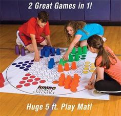 two girls and one boy playing a board game on the floor with words that read 2 great games in 11