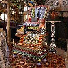 a chair sitting on top of a rug next to a fire place