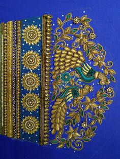 an intricately designed piece of cloth with gold and blue trimmings on it