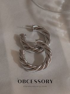 Silver Twisted Hoop Earrings Silver Hoop Earrings With A Modern Twist, Earring Aesthetic, Silver Earrings Aesthetic, Earrings Silver Hoops, Hoops Silver, Earrings Aesthetic, Big Hoop Earrings, Layered Bracelets, Silver Accessories