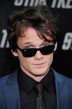 a man wearing sunglasses and a suit at the star trek film premiere in los angeles