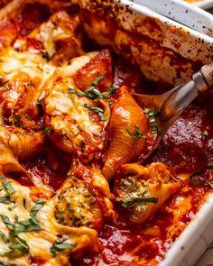 a casserole dish filled with meat and sauce