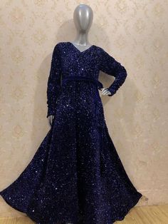 "This is a gorgeous sequin velvet stretchable maxi dress with full sleeves. It comes with a belt. Total flair is 140 inches all around. Length of the dress is 55 inches. Sizes available are  Small (chest 36\") Medium (chest 40\") Large (chest 44\")" Glamorous Floor-length Velvet Gown, Glamorous Velvet Floor-length Gown, Blue Winter Party Maxi Dress, Festive Long Sleeve Sequin Maxi Dress, Blue Maxi Dress For Winter Party, Blue Winter Maxi Dress For Party, Festive Full-length Sequin Dress, Festive Long Sleeve Evening Gown, Festive Long Sleeve Velvet Dress