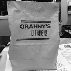 a paper bag sitting on top of a table