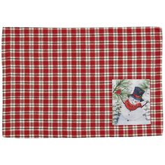 a red and white checkered placemat with a snowman on the front pocket