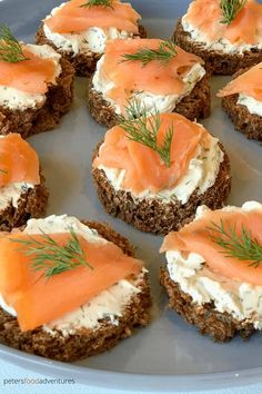 small crackers with cream cheese and salmon on them