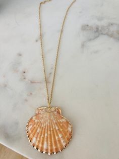 This necklace has a scallop pendant which has scalloped gold edging. It is on an 18 inch , 18k gold plated chain which is hypoallergenic. This necklace is unique, beautiful and makes a statement. Keep it for yourself or give it as a special gift! Vintage Shell-shaped Necklaces For Gifts, Coquille Saint Jacques, Fernandina Beach, Scallop Shell, Scallop Shells, Shell Necklace, Shell Necklaces, Gold Plated Chains, Special Gift