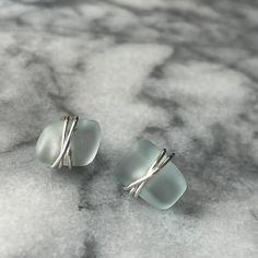 Sea Glass Wrapped Studs In Sterling Silver Or Gold Filled Cute Cute Studs. Light Aqua Coke Bottle Color. Hand Wrapped In 925 Sterling Silver Or 14k Gold Filled. Each Piece Of Glass Is Smooth And Tumbled And Are Unique. Each Set Will Vary In Size From 40” To .50” (No Larger Than 1/2” Wide) I Hand Wrapped The Wire And Make This Stud Myself. Modern And Beautiful. Mahalo For Shopping! Sea Glass Crafts Jewellery, Studs Gold, Sea Glass Crafts, Gem Earrings, Coke Bottle, Sea Glass Earrings, Blue Sea Glass, Light Aqua, Sea Glass Art