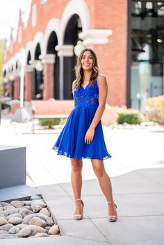 A model in a simple cocktail dress features delicate straps with a semi-sheer lace bodice and keyhole back. Simple Cocktail Dress, Simple Cocktail, Hoco Dress, Silver Heels, Hoco Dresses, Glam Fashion, Lace Bodice, Sheer Lace, Blue Lace