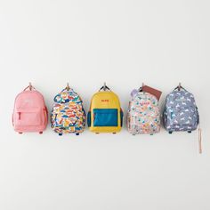 A floral backpack that's extra comfy and ready to handle daily adventures. Patterned with a colorful collection of garden friends that flit and flutter over the white exterior, the kids' large knapsack is constructed of supremely durable polyester made from recycled water bottles. A roomy interior holds everything your kid needs-books, school supplies, extra layers-and there's a padded pocket to keep their tablet protected. Outside pockets hold snacks, water bottles and more. Pair this book bag Playful Outdoor Bags For Back To School, Playful Multicolor Outdoor Bag, Playful Backpack For Travel And Back To School, Playful Outdoor Backpack, Playful Backpack For End Of School Year Outdoor Use, White Backpack For Daycare, White Standard Backpack For Daycare, Lunch Boxes For School, Books School