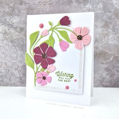 a close up of a greeting card with flowers on the front and bottom, which reads wishing the best