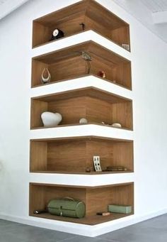 there is a shelf with many items on it in the room that looks like shelving