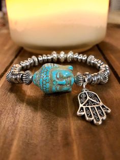 Buddha & Hamsa Hand Bracelet  In Silver.   Enlightened one, Spiritual Bracelet. To follow the truth & the right path.  Harmony & Happiness Spiritual & Healing Energy Can 🐝 worn alone or stacked.  Handmade with Love️  Please note: Contains small parts, not recommended for children 0-3. Children over this age should be supervised if wearing. Blue Luck, Spiritual Bracelets, Earrings Outfit, Buddha Bracelets, Womens Bracelet, Jewelry Illustration, Jewelry Bracelets Silver, Diamond Jewelry Necklace, Hand Bracelet