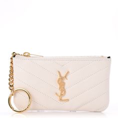 This Is An Authentic Saint Laurent Calfskin Matelasse Monogram Key Pouch In Porcellana. This Chic Modern Key Pouch Is Finely Crafted Of Smooth Off White Calfskin Leather. This Key Pouch Features A Brass Ysl Logo On The Front And A Brass Zipper Pull That Opens To A Black Fabric Interior With A Attached Key Ring For The Everyday Small Essentials With The Chic Style Of Saint Laurent! Size Base Length: 5.25 In Height: 3.00 In Width: 0.50 In Good Condition! Comes With Dustbag, Black Cards, & Box! Black Cards, Ysl Saint Laurent, Ysl Logo, Key Pouch, Black Card, Saint Laurent Bag, Rebecca Minkoff Mac, The Chic, Black Fabric