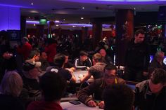 a group of people sitting at tables in a room