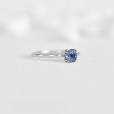 Experience the captivating beauty of our solitaire ring featuring a stunning light blue sapphire. This versatile piece is perfect for any occasion, whether as a classic engagement ring or an everyday accessory that breaks the routine. The delicate hue of the gemstone is accentuated by the ring's exquisite craftsmanship, creating a unique charm that's both understated and elegant. Its timeless design and captivating beauty make it an exceptional addition to any collection. Light Blue Sapphire, Classic Engagement Ring, The Routine, Classic Engagement, Gem Diamonds, Round Light, Diamond Jewelry Designs, Classic Engagement Rings, Everyday Accessories