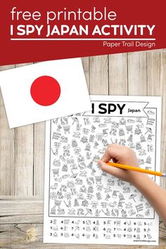 a hand holding a pencil over a japanese activity sheet with the text, free printable ispy japan activity paper trail design