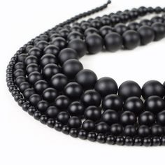 High Quality Black Onyx Beads Approximate Product Specifications: 4mm: Bead Count: about 90 pcs. Bead Size: 4mm Hole Size: .5mm 6mm: Bead Count: about 60 pcs. Bead Size: 6mm Hole Size: .5mm 8mm: Bead Count: about 50 pcs. Bead Size: 8mm Hole Size: 1mm 10mm: Bead Count: about 40 pcs. Bead Size: 10mm Hole Size: 1mm 12mm: Bead Count: about 34 pcs. Bead Size: 12mm Hole Size: 1mm 14mm: Bead Count: about 28 pcs. Bead Size: 14mm Hole Size: 1mm https://www.etsy.com/shop/RiverValleyGems?ref=hdr_shop_menu Purple Chalcedony, Gemstone Beads Wholesale, Onyx Crystal, Stones For Jewelry Making, Onyx Bead, Beaded Material, Wholesale Beads, Agate Beads, Agate Gemstone