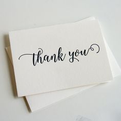 two thank cards with the words thank you written in cursive ink on them