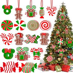 a christmas tree decorated with candy canes and gingerbread ornaments next to other holiday decorations