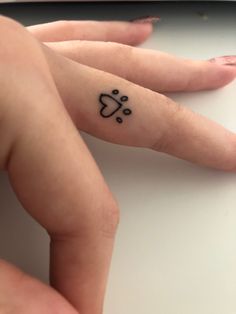 a person with a small tattoo on their left hand