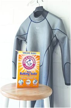 a wet suit sitting on top of a table next to a box of baking soda