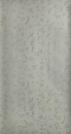 an image of a white wallpaper with floral designs on the back and bottom half