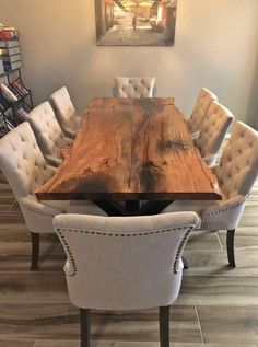 a dining room table with chairs around it