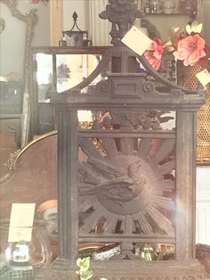 an old clock is sitting on a table