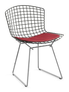 an orange chair sitting on top of a metal frame with a red seat pad underneath it