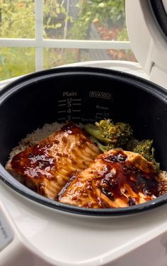 the meal is prepared and ready to be eaten in the slow cooker, with broccoli