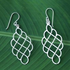 Shining wave motifs create an elegant illusion of interwoven lines in this pair of Thai dangle earrings. Srimuang crafts each earring from two separate layers of brushed sterling silver hanging from a single hook. Achieve different looks by arranging the layers so that they align or overlap. Silver Dangle Earrings, Sterling Silver Dangle Earrings, Wire Art, Silver Earrings Dangle, Hook Earrings, Wire Jewelry, Active Wear For Women, Diy Jewelry, Premium Quality