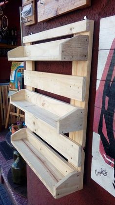 a wooden bench sitting next to a wall