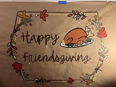 a happy thanksgiving sign with a turkey laying on a plate