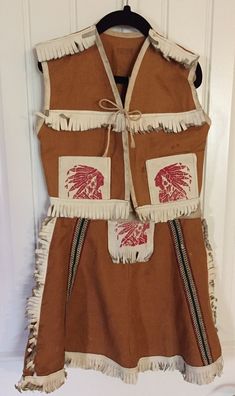 a brown vest with red and white designs on it