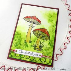 a close up of a card with mushrooms on it