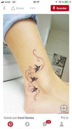 a woman's foot with birds on it and swirls around the ankle area