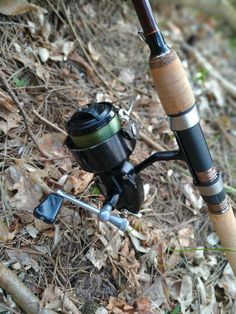 a fishing rod and reel on the ground