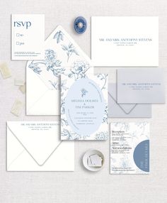 an assortment of wedding stationery items including envelopes, cards and other personal information