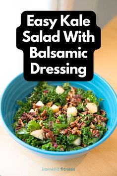 a blue bowl filled with salad on top of a wooden table