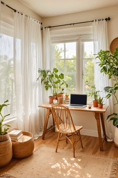 a laptop computer sitting on top of a wooden desk in front of a window filled with potted plants