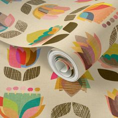 an image of a wallpaper with colorful flowers on the background and a roll of tape