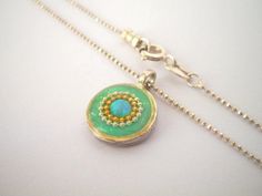 "Unique opal necklace. Tiny mint green & gold boho pendant necklace. Resin & sterling silver necklace. Every woman needs a gorgeous opal necklace that she'll treasure forever. This tiny, lightweight pendant necklace will keep your look feminine and elegant. A beautiful, classic addition to both your every day & evening wear. This necklace although small, will not go unnoticed, get ready to receive a lot of compliment on it! A great valentine's day, mothers day, or birthday gift for m Gold Bohemian Necklaces With Cabochon, Bohemian Gold Cabochon Necklaces, Gold Bohemian Cabochon Necklace, Bohemian Gold Cabochon Necklace, Bohemian Green Jewelry With Delicate Chain, Handmade Opal Round Pendant Necklace, Green Necklace With Coin Pendant, Green Necklace With Coin Pendant As Gift, Green Necklace With Coin Pendant For Gift