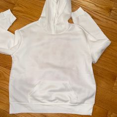 Hooded Sweatshirt In White With Read Writing On Back. Brand New. Size Large White Hooded Sweatshirt With Double-lined Hood, White Hoodie With Adjustable Hood, Oversized Hooded White Top, Oversized White Hooded Top, White Hoodie With Kangaroo Pocket, White Crew Neck Sweatshirt With Adjustable Hood, White Hooded Sweatshirt With Ribbed Cuffs, White Long Sleeve Sweatshirt With Adjustable Hood, White Sporty Top With Kangaroo Pocket