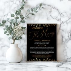 a black and gold wedding ceremony sign with greenery on it next to a vase