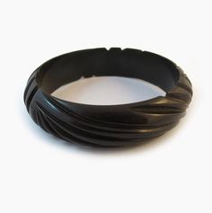 Vintage Bakelite Bangle - Wave Carved Dimensions: Internal Diameter - 6.5cm, Width - 2cm  Materials: Bakelite Era: Circa 1950's Condition: Excellent Vintage Black Bangle, Bakelite Bangles, Vintage Bakelite, Bangle Bracelets, Jewelry Bracelets, Bangles, Conditioner, Carving, Cuff