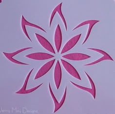 a close up of a paper cut out with pink flowers on the inside of it