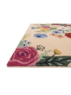 an area rug with flowers and leaves on it