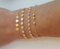 Dainty gold or silver plated bracelet. Available in 3 different styles: - 4 or 5 mm gold or silver disc bracelet. - Gold ball bracelet. Size balls 1.7mm. - Gold four disc bracelet. Disc size 4 mm. * The bracelet is lead - nikkelfree. * It,s  the perfect bracelet to wear everyday, as layered bracelet or by itself. * The available bracelet sizes are 6 till 8 inch. * Wrapped in a nice Organza jewelry bag. * Matching chokers or necklaces are also available here on my website: www.etsy.com/nl/shop/Sa Dainty Gold-plated Beaded Bracelets, Dainty Gold-plated Round Beaded Bracelets, Dainty Gold Plated Beaded Bracelets, Handmade Gold Chain Bracelet With Round Beads, Gold Round Minimalist Charm Bracelet, Dainty Metal Bracelets With Round Beads, Nickel Free 14k Gold-filled Bracelet, Gold Delicate Chain Bracelet, Nickel-free 14k Gold-filled Gold Bracelet